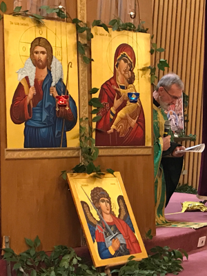 Fr. Geoff kneeling in prayer